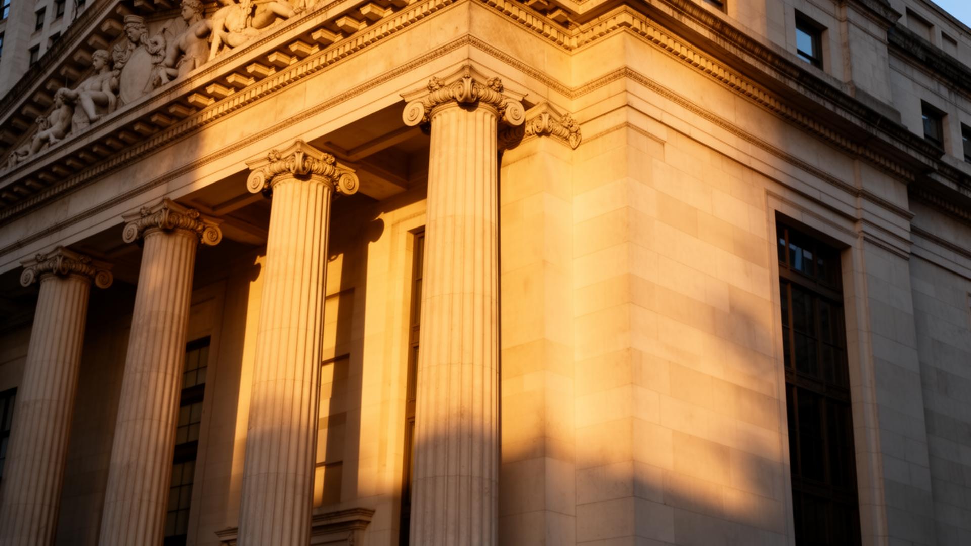 Classical limestone columns at golden hour